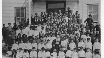 March 4th, 2022, | News You Can Use From Indian Country For This Week bishop-grouard-with-school-children-circa-1924
