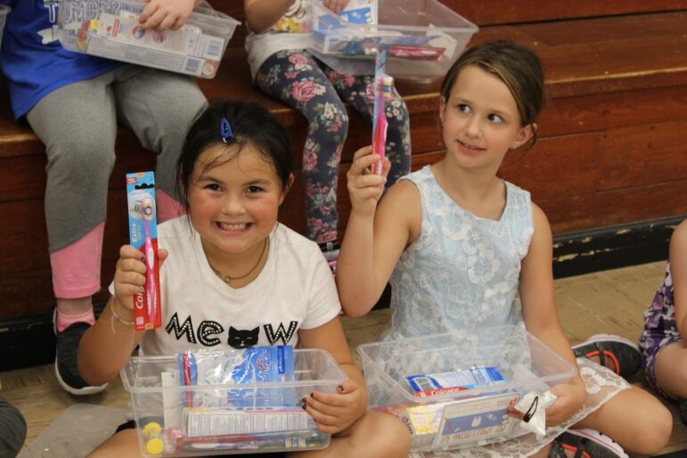 RS -- Smile Strong CNF Grand View students receiving their dental kits Smiling Strong