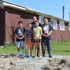 Native American family getting access to clan water.