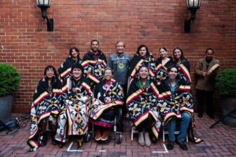 Group of 2024 Dreamstarter participants wearing traditional Native blankets.