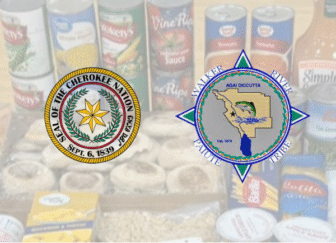 Cherokee Nation and Walker River Paiute Tribe logos over canned food background