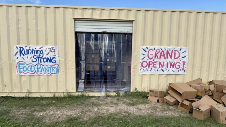 Running Strong Food Pantry grand opening at Oyate Ta Kola Ku Community Center, showing the new container pantry ready to serve local families.