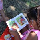Native girl reading a book
