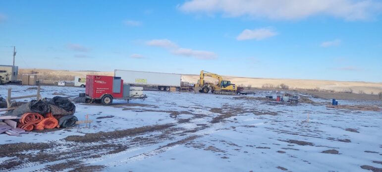 Future site of the OTKK community center pre-building on snowy land