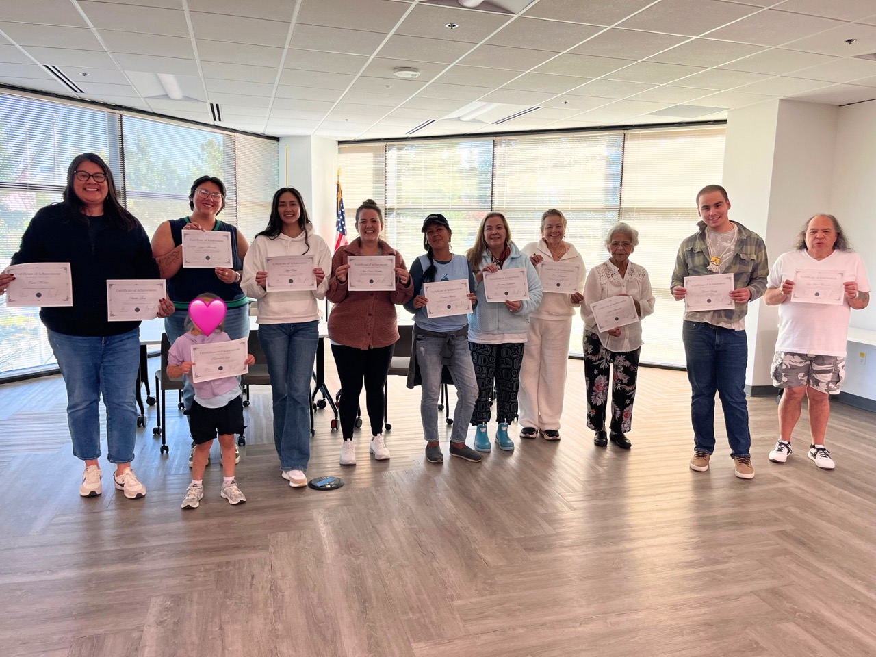 Participants holding certificates after completing the Haida Language Revitalization workshop in Seattle led by Elizah Dominy