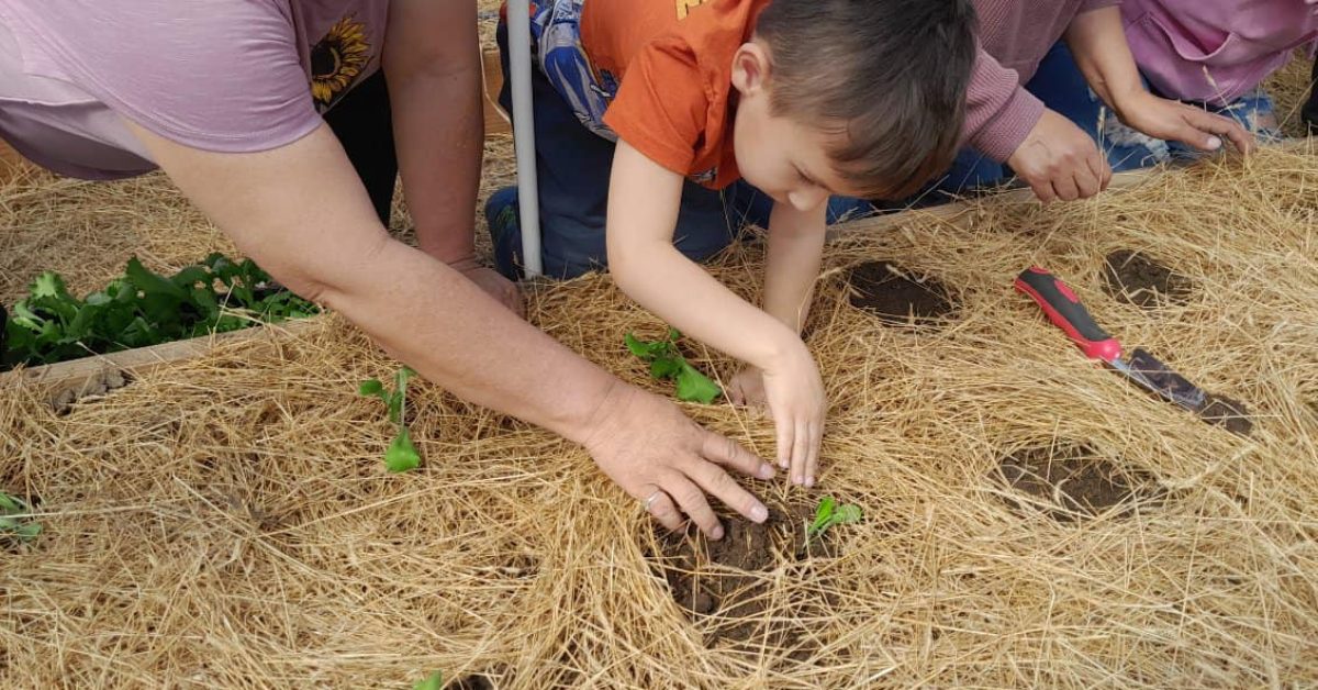 OTKK Garden Kids April 4 A Native American woman is helping a young boy learn how to plant crops in an effort to transform Native American food deserts.
