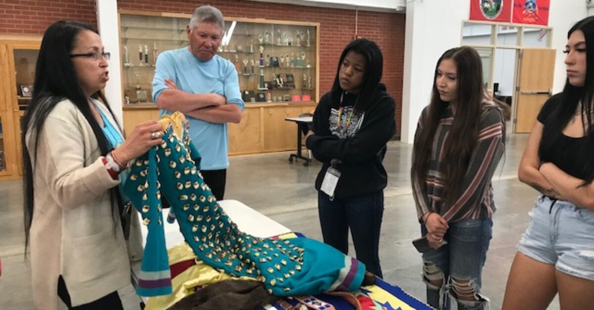 RS -- DST 21-22 Gwendolyn Couture Looking over regalia brought in for interview on Pow-wo Trail_0641