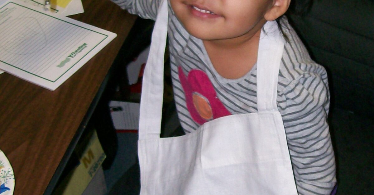 RS -- Thanksgiving 12_Amelia Lone Elk with RS Thansgiving Apron on