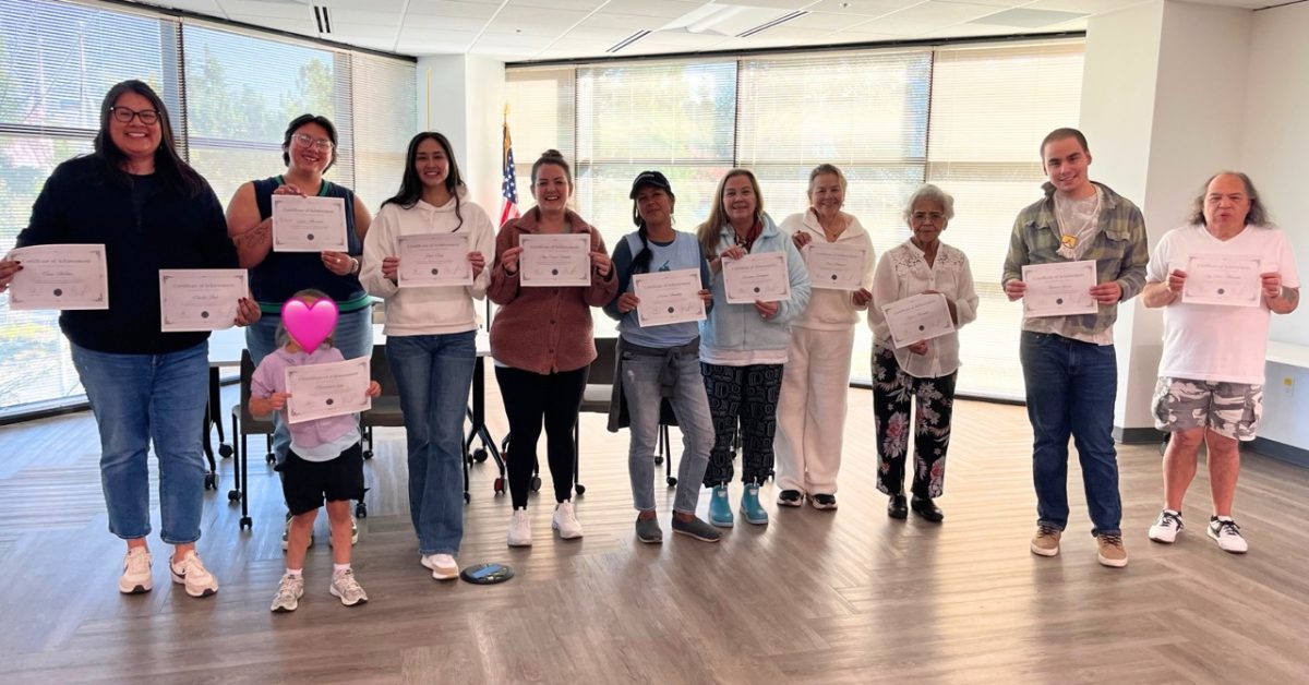 Participants holding certificates after completing the Haida Language Revitalization workshop in Seattle led by Elizah Dominy
