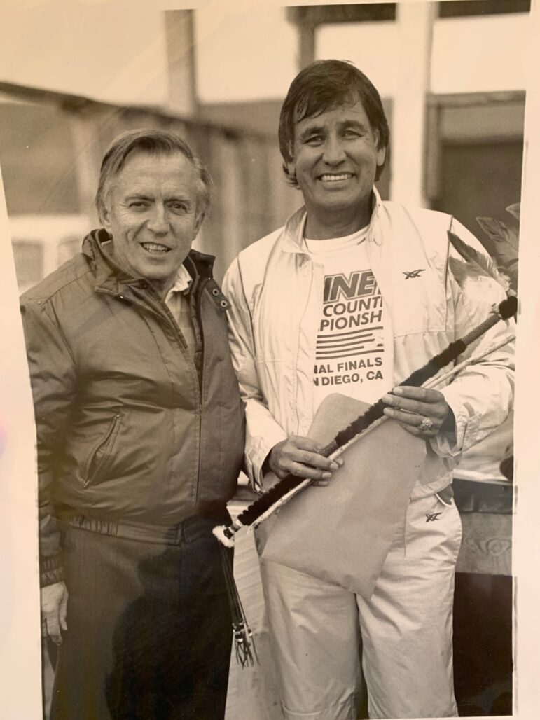 Historic photo of Billy Mills and Gene Krizek standing together.