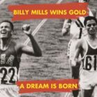 Billy Mills (USA 722) crosses the finish line with arms raised, winning the 10,000m gold medal at the 1964 Tokyo Olympics.