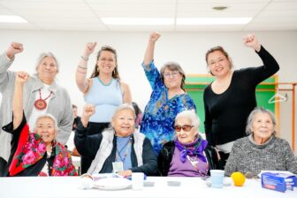 Native elders celebrating together at community wellness event supported by Running Strong Healthy Elder Box program