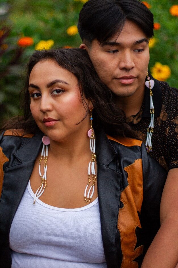 Models wearing dentalium jewelry created by Jarrette Werk