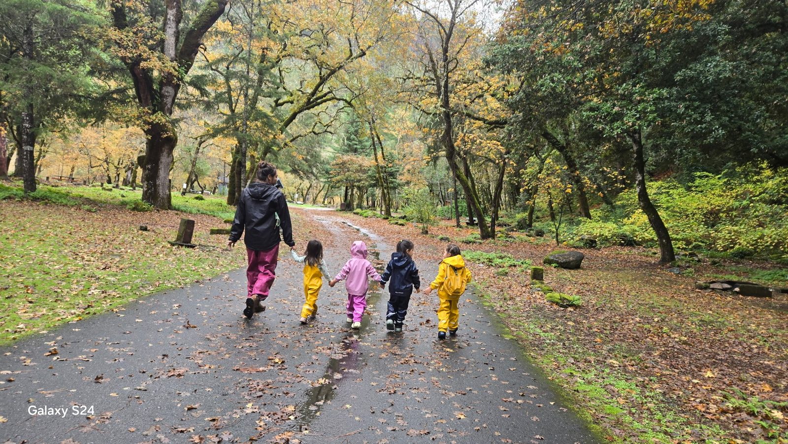 Hupa Language Immersion Nest teacher and children walking outdoors