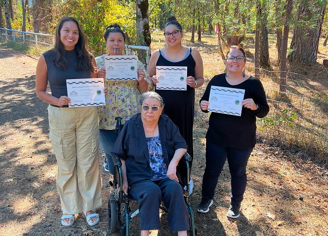 Verdena Parker with Hupa language teachers holding certificates