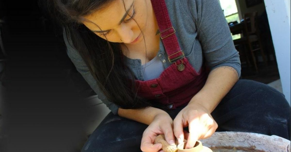 RS -- DSC Brooke Waldron throwing a small vessel on pottery wheel throwingonwheel-min