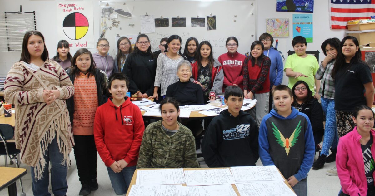 RS -- Keya Foundation Cheryl Red Bear with students after storytelling event_1465