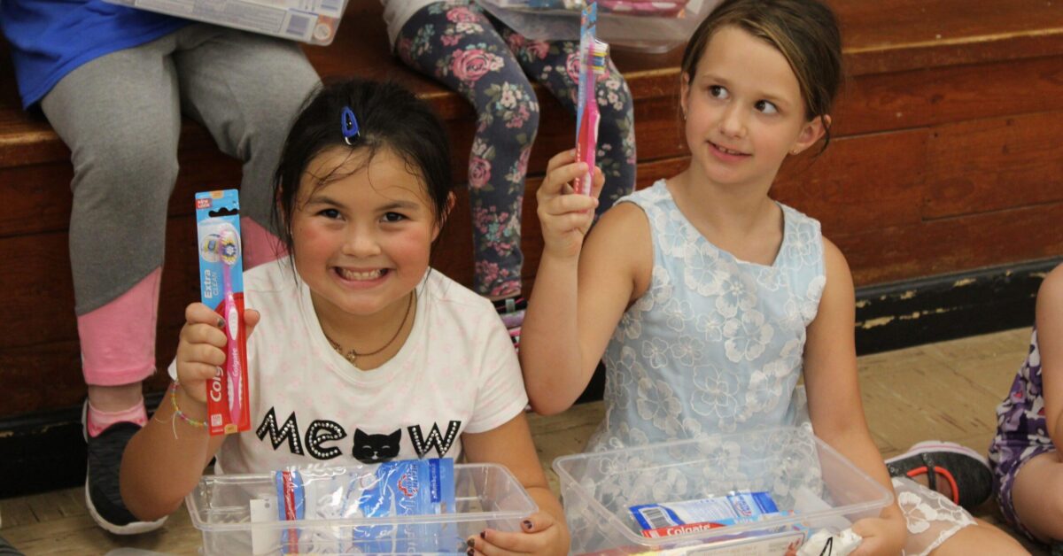 RS -- Smile Strong CNF Grand View students receiving their dental kits Smiling Strong